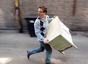 brice running with a piece of furniture